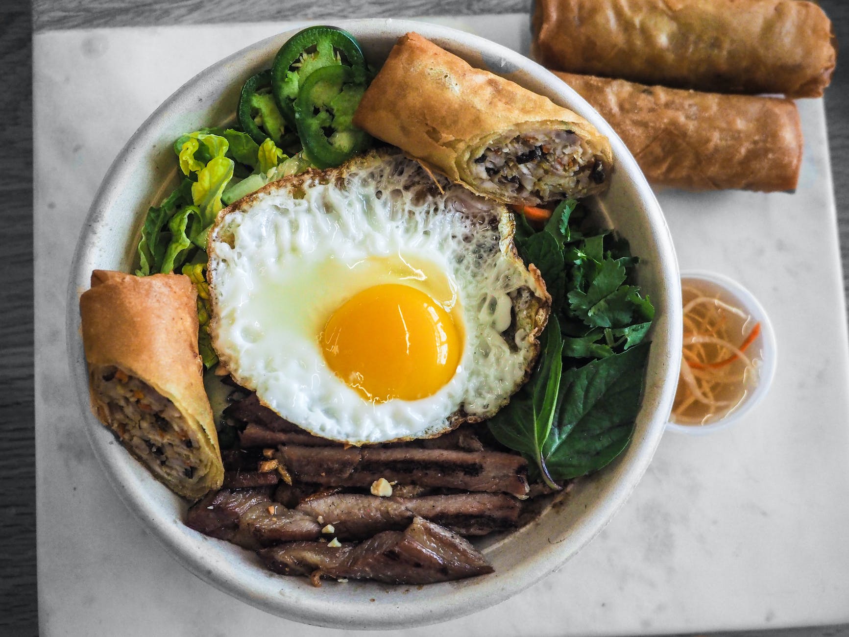 bowl of fried food and fried egg